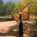 Paulina Milligan stilt walking as a butterfly character for Jessica Packard Entertainment